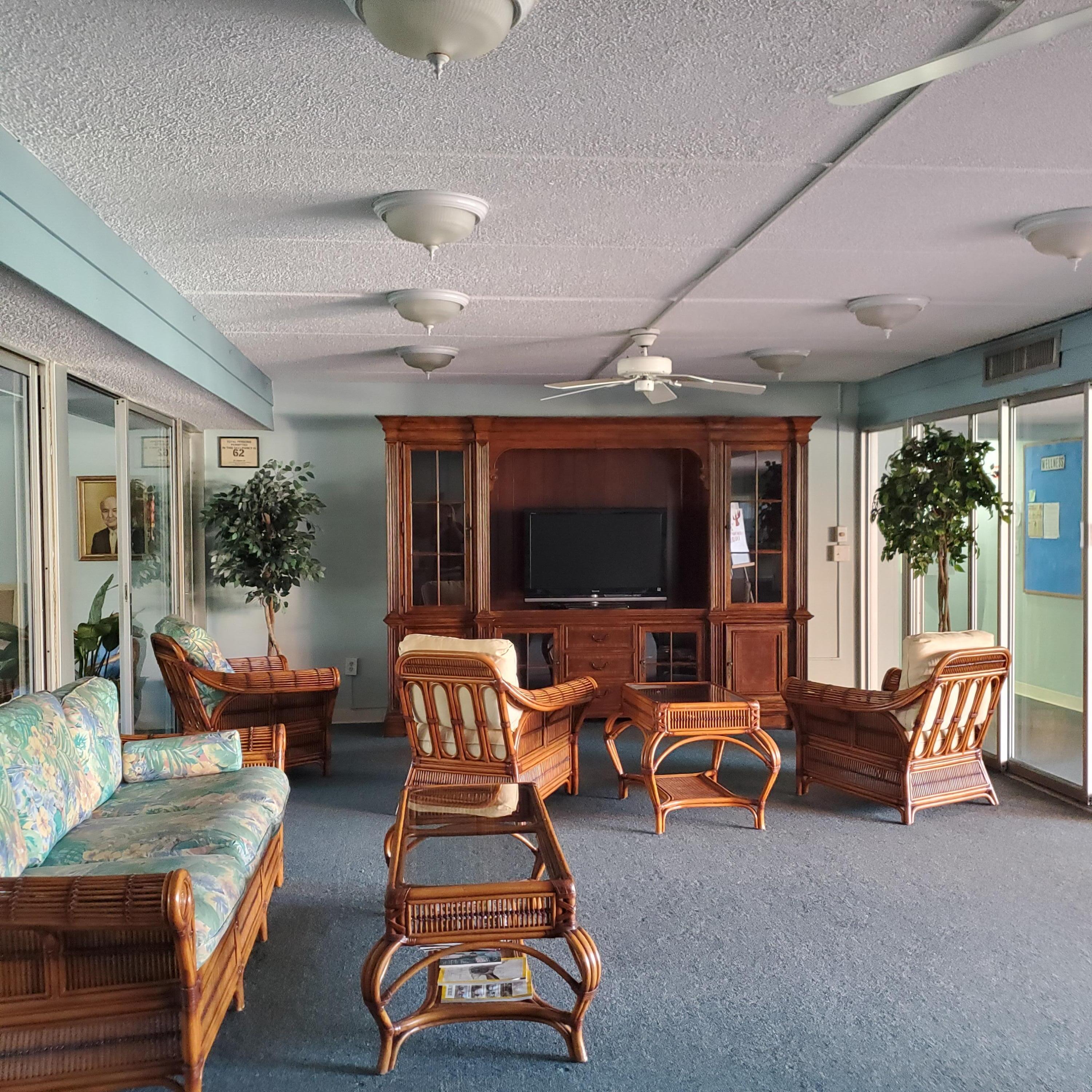 2600 Southeast Ocean Boulevard, Unit A11 Stuart, FL 34996 - Photo 46 of 62 a living room with furniture and a flat screen tv