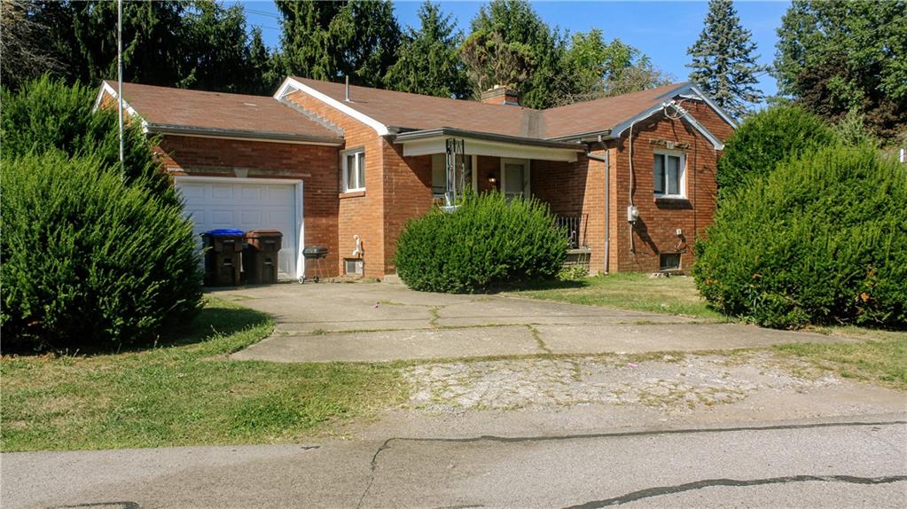 1638 Shady Drive Farrell, PA 16121 - Photo 1 of 21 a front view of a house with a garden and yard