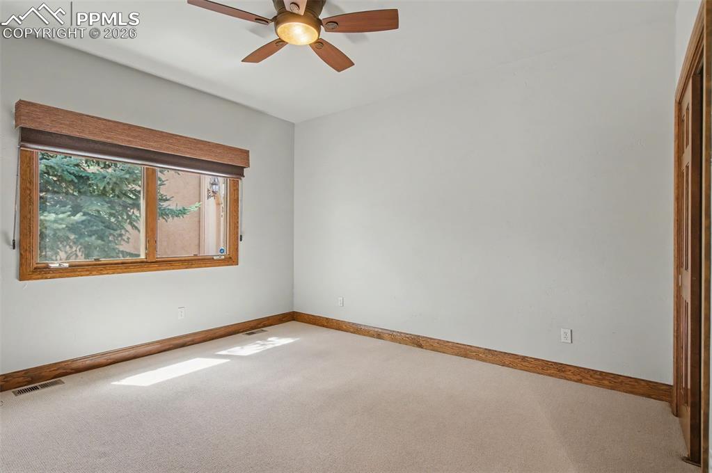 4215 Star Ranch Road Colorado Springs, CO 80906 - Photo 41 of 44 a view of an empty room with a window