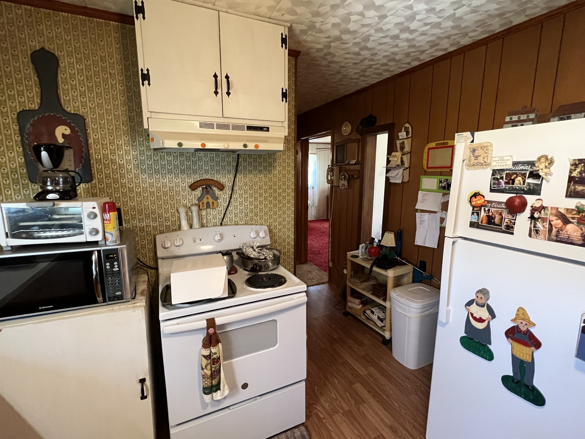 413 Rascal Town Road Loretto, TN 38469 - Photo 23 of 36 a kitchen with a stove and a white refrigerator