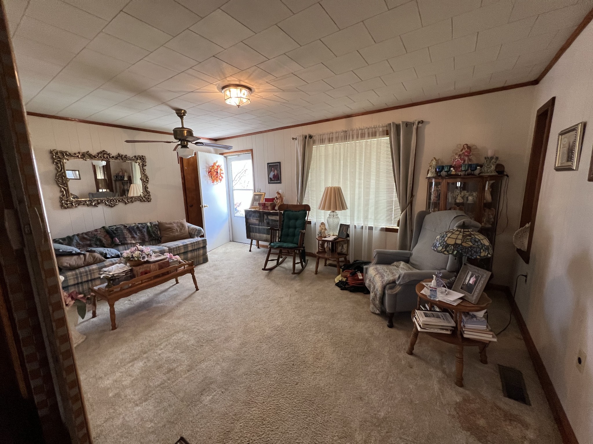 413 Rascal Town Road Loretto, TN 38469 - Photo 24 of 36 a living room with furniture and a flat screen tv