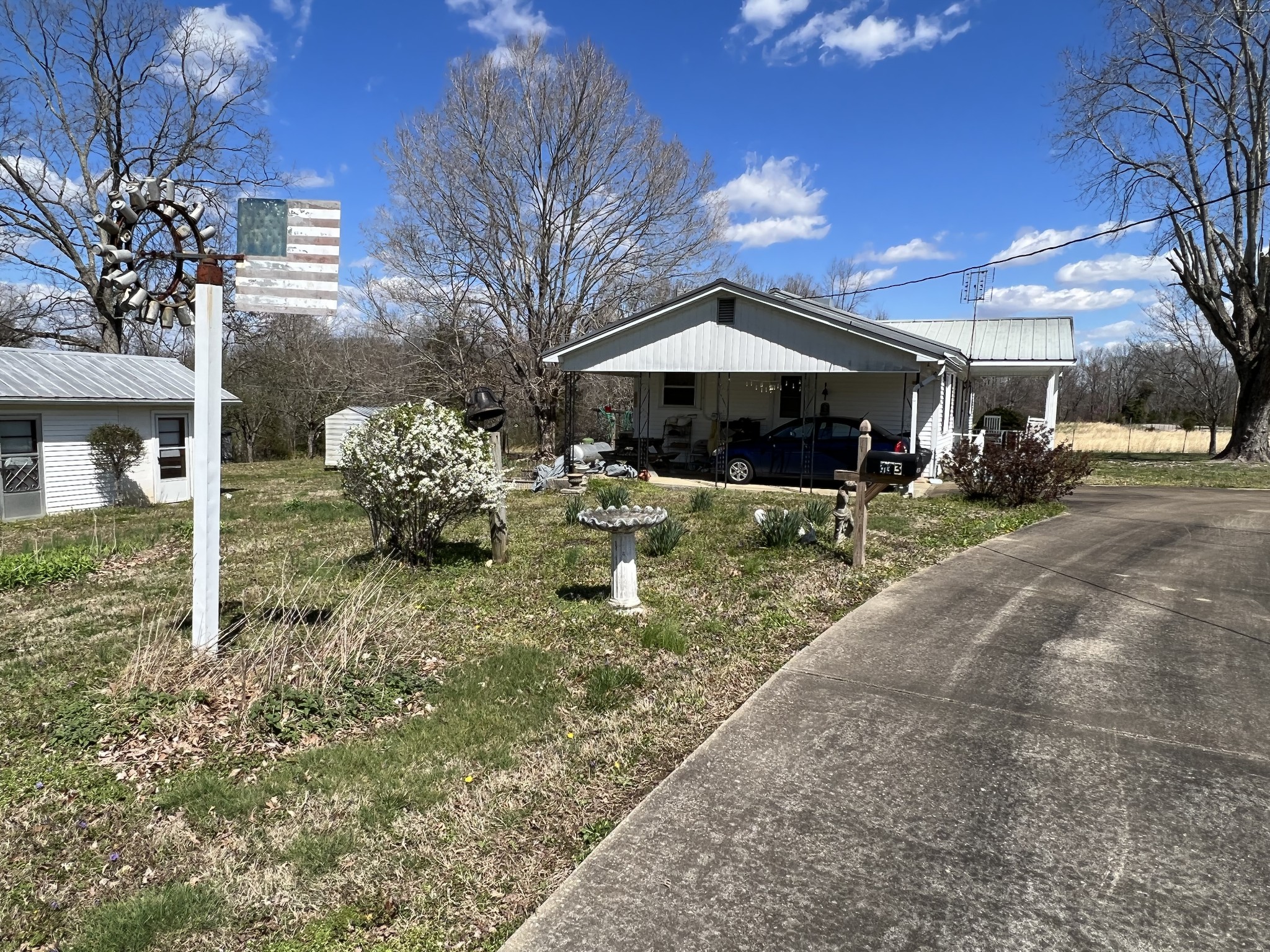 413 Rascal Town Road Loretto, TN 38469 - Photo 8 of 36 a view of a house with a yard and sitting area
