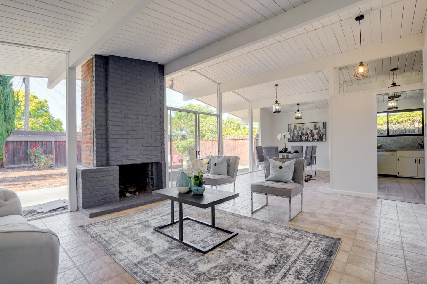 721 Stendhal Lane Cupertino, CA 95014 - Photo 16 of 54 a living room with furniture and a fireplace