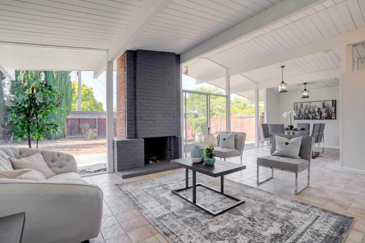 721 Stendhal Lane Cupertino, CA 95014 - Photo 17 of 54 a living room with furniture and a fireplace