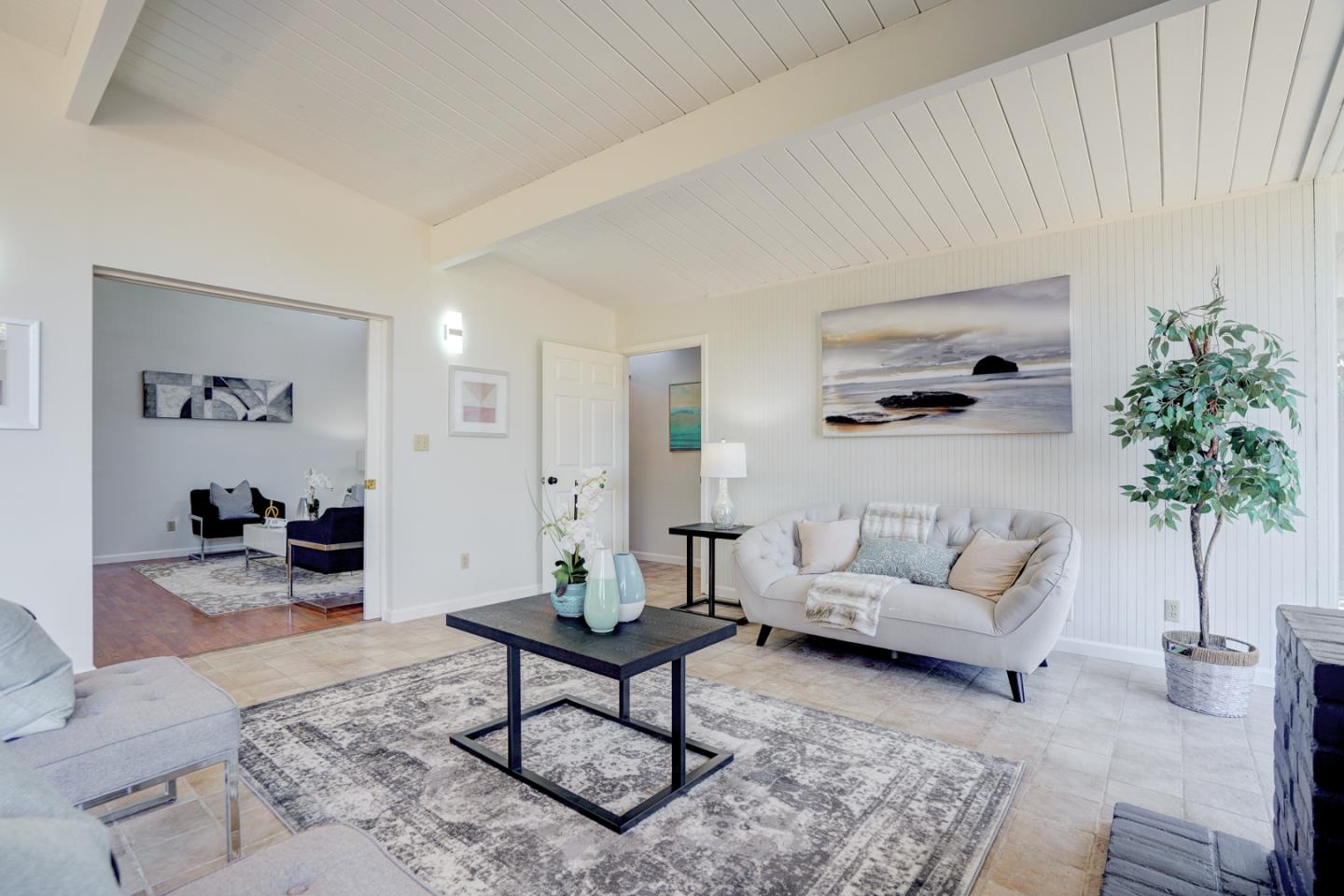 721 Stendhal Lane Cupertino, CA 95014 - Photo 19 of 54 a living room with furniture and a potted plant