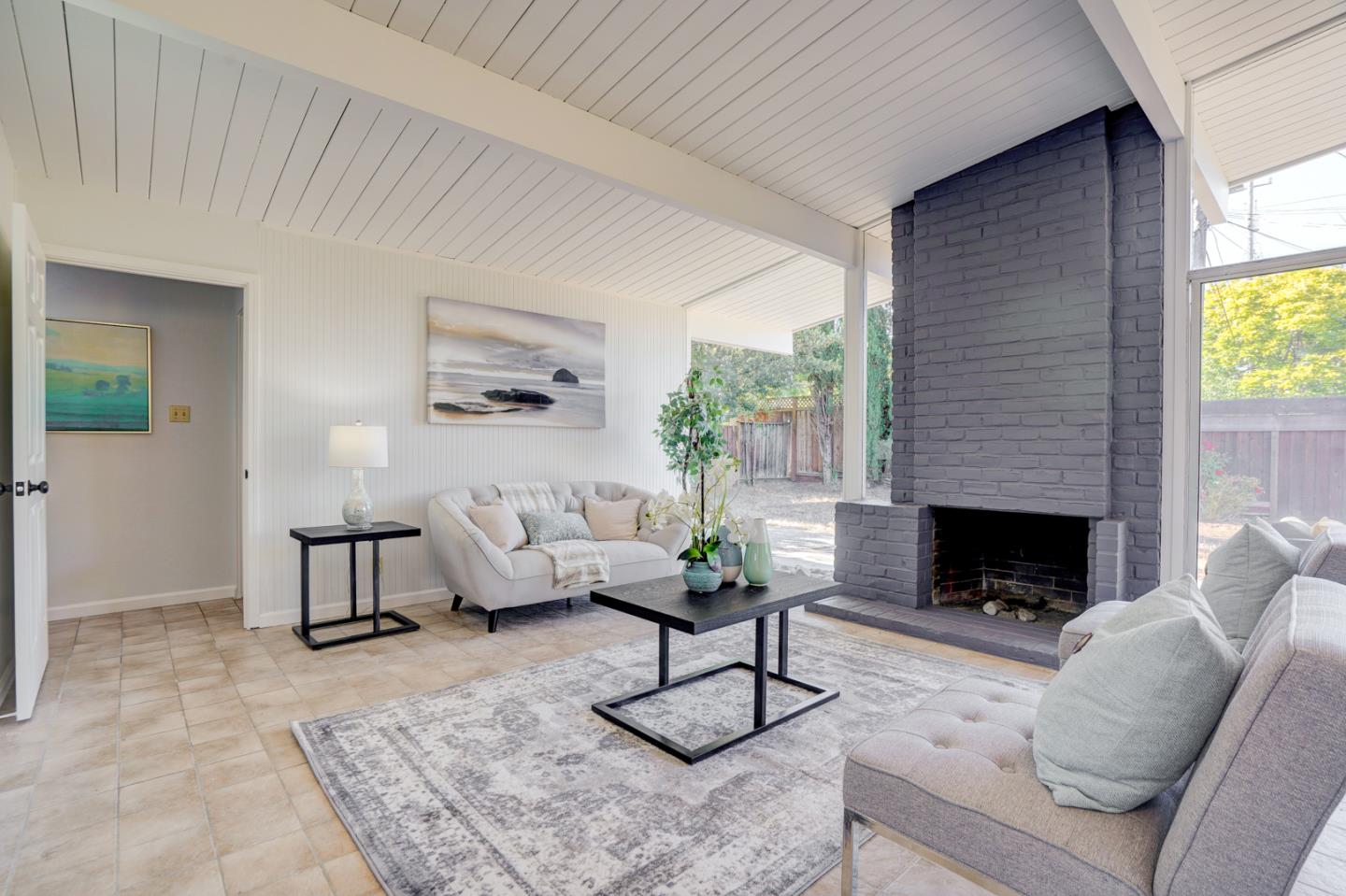 721 Stendhal Lane Cupertino, CA 95014 - Photo 20 of 54 a living room with furniture fireplace and window