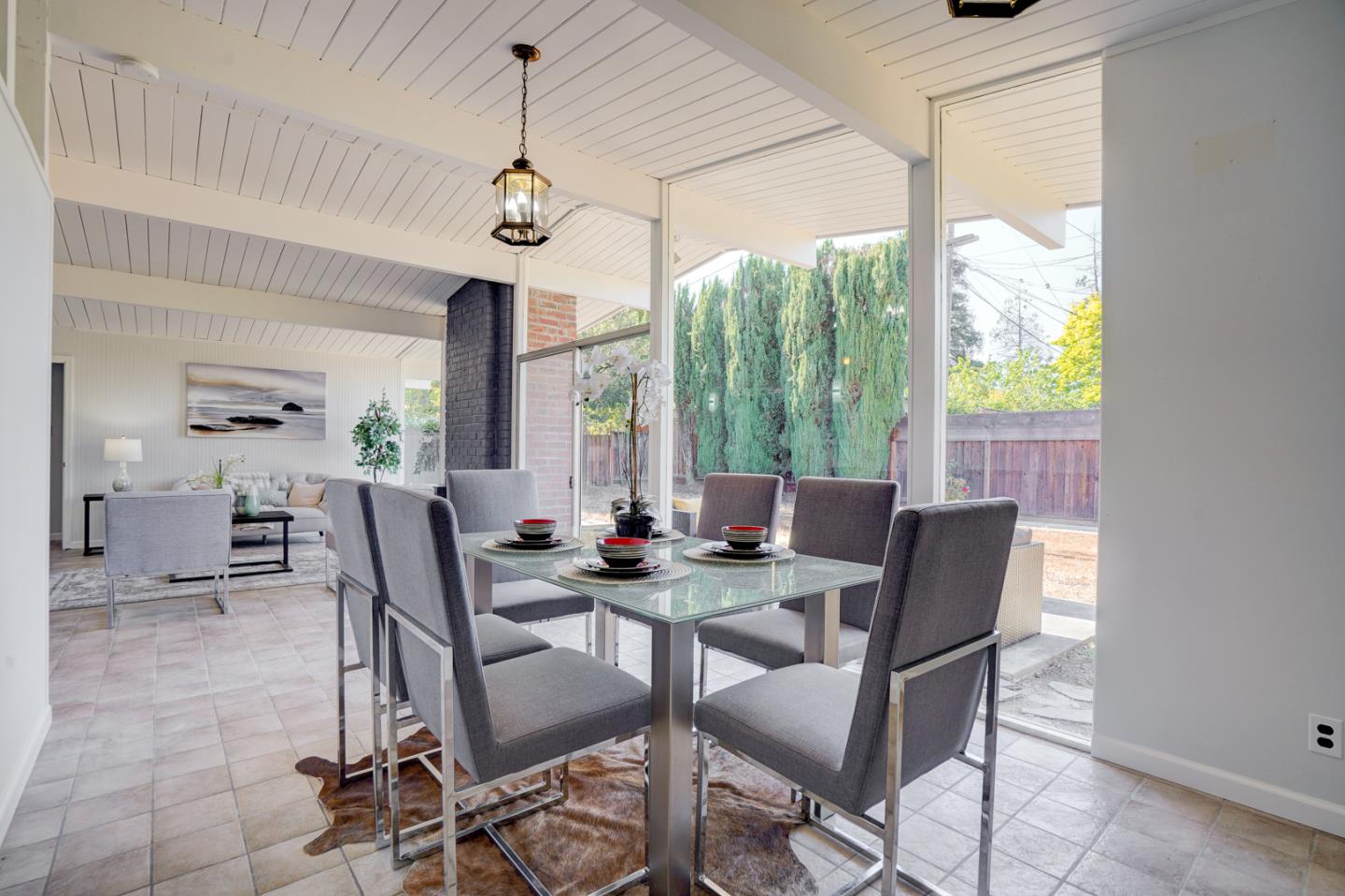 721 Stendhal Lane Cupertino, CA 95014 - Photo 24 of 54 a dining room with furniture a chandelier and wooden floor