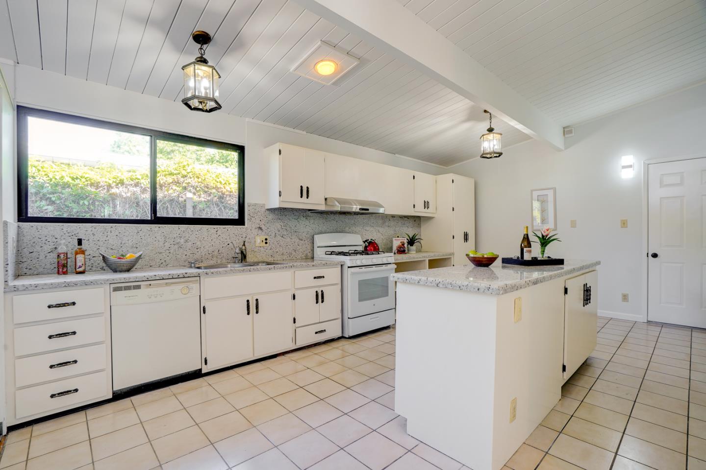 721 Stendhal Lane Cupertino, CA 95014 - Photo 25 of 54 a kitchen with granite countertop white cabinets white appliances with a sink and dishwasher