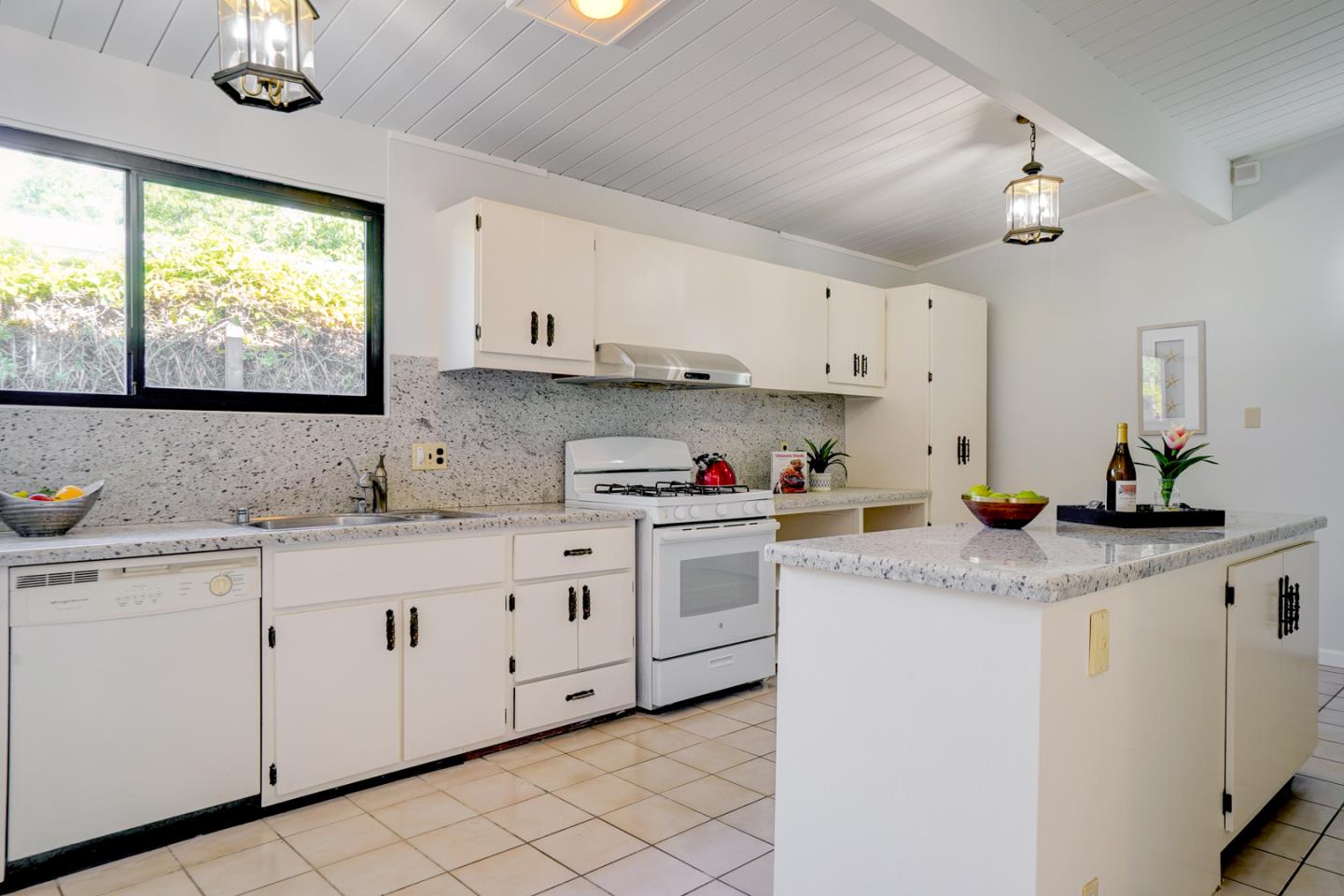 721 Stendhal Lane Cupertino, CA 95014 - Photo 27 of 54 a kitchen with granite countertop white cabinets white appliances a sink and a window