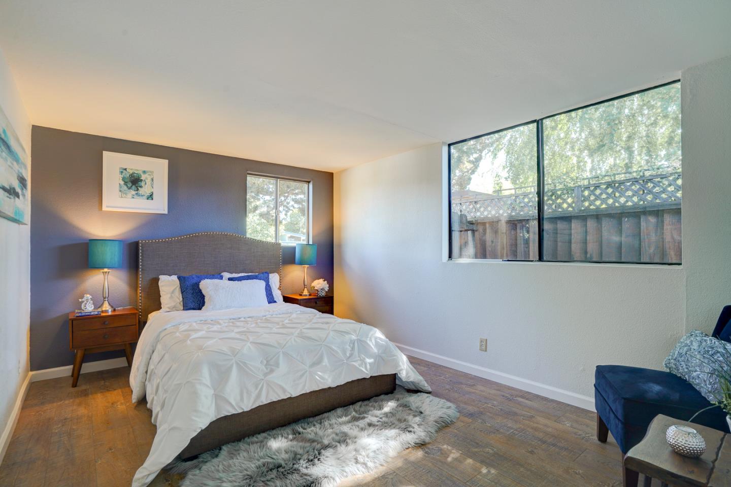 721 Stendhal Lane Cupertino, CA 95014 - Photo 30 of 54 a bedroom with a bed and wooden floor