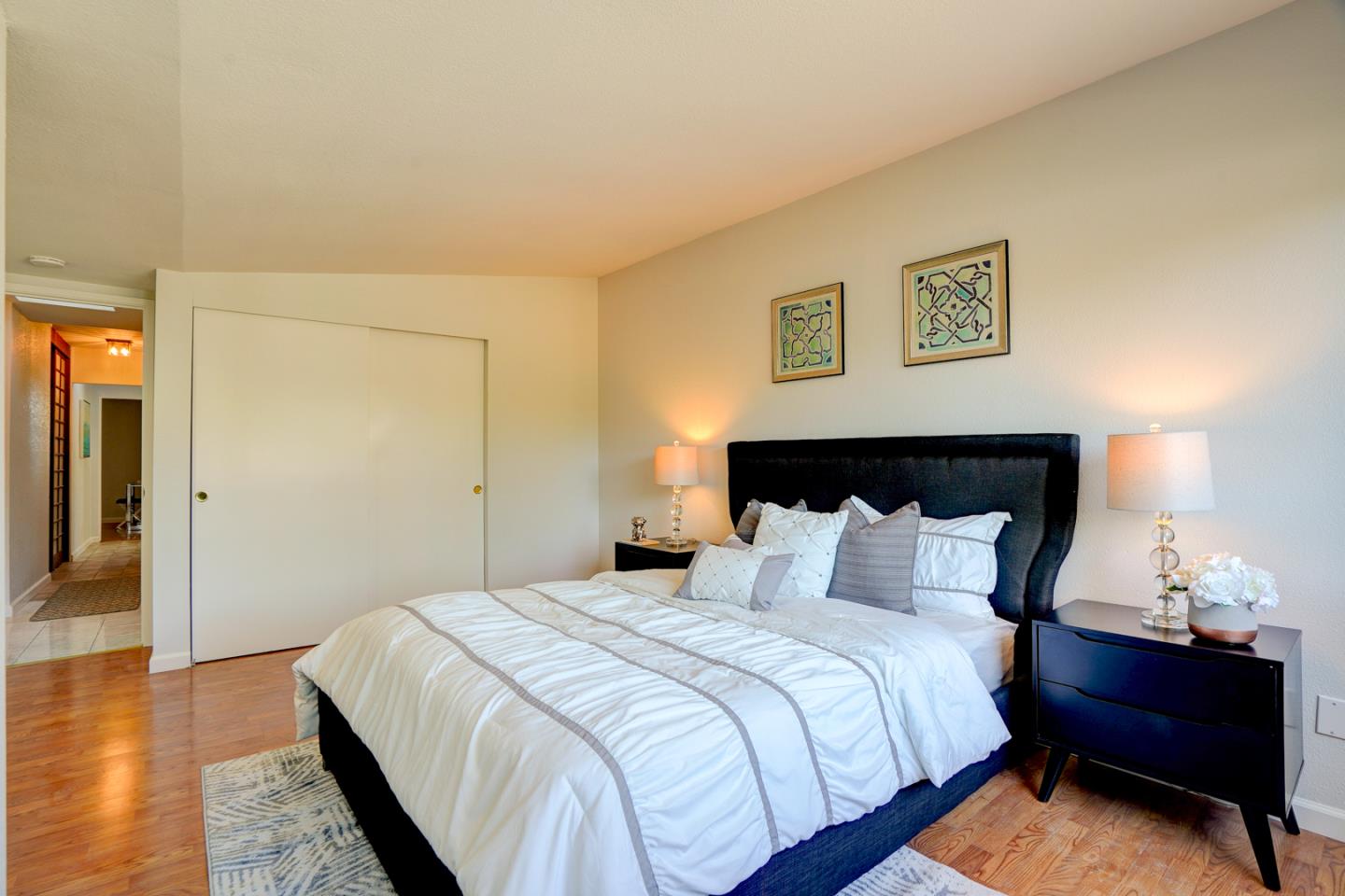 721 Stendhal Lane Cupertino, CA 95014 - Photo 35 of 54 a bedroom with a bed and a lamp