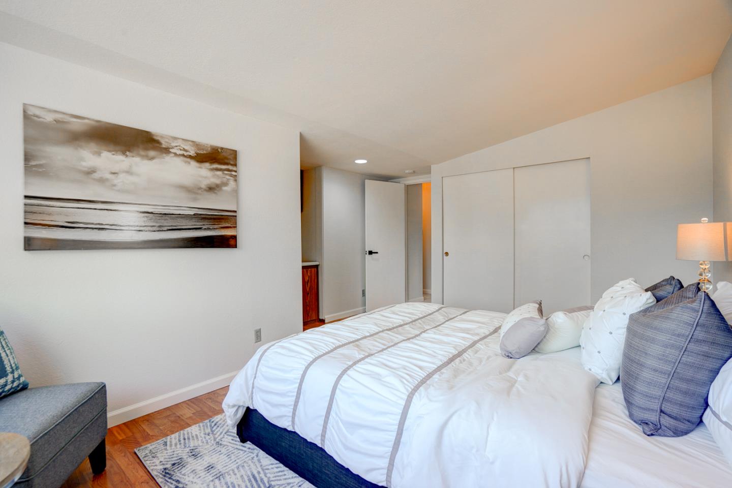 721 Stendhal Lane Cupertino, CA 95014 - Photo 36 of 54 a bedroom with a bed and wall painting