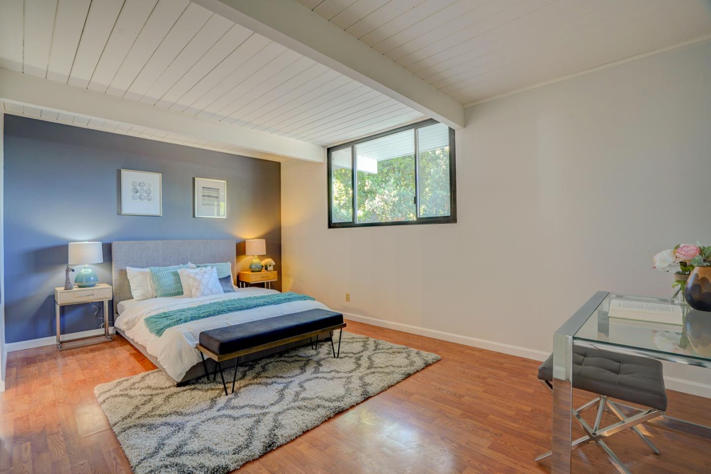 721 Stendhal Lane Cupertino, CA 95014 - Photo 38 of 54 a room with a bed and a wooden floor