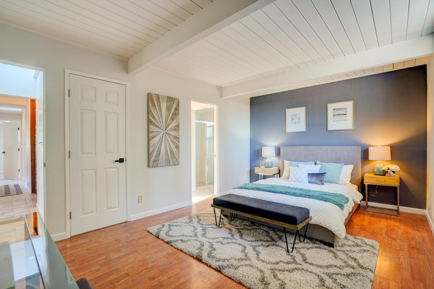 721 Stendhal Lane Cupertino, CA 95014 - Photo 40 of 54 a bedroom with a bed and wooden floor