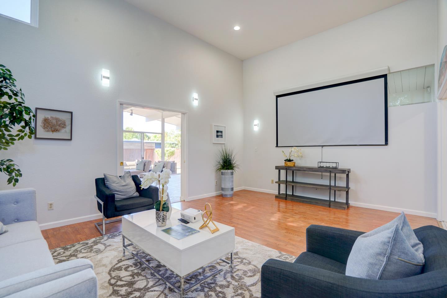 721 Stendhal Lane Cupertino, CA 95014 - Photo 4 of 54 a living room with furniture and a flat screen tv