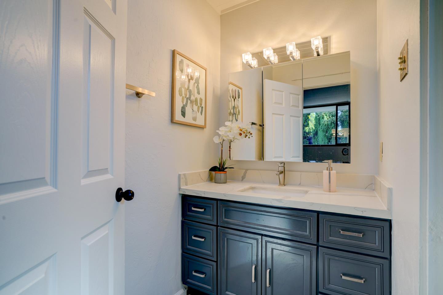 721 Stendhal Lane Cupertino, CA 95014 - Photo 43 of 54 a bathroom with a sink vanity and mirror