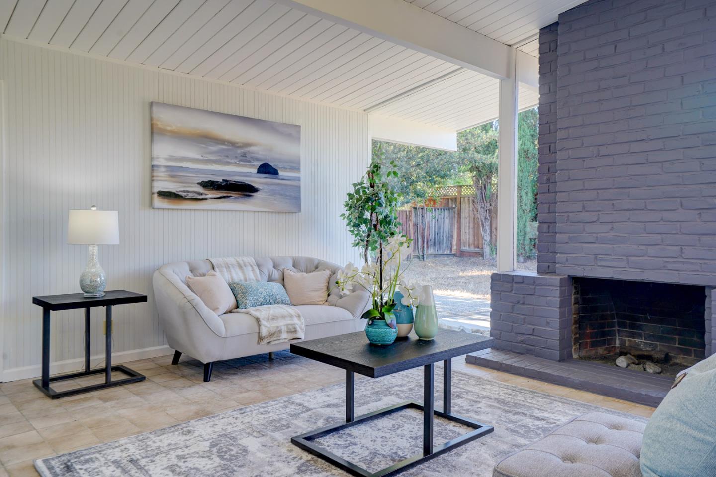 721 Stendhal Lane Cupertino, CA 95014 - Photo 45 of 54 a living room with furniture a window and a fireplace