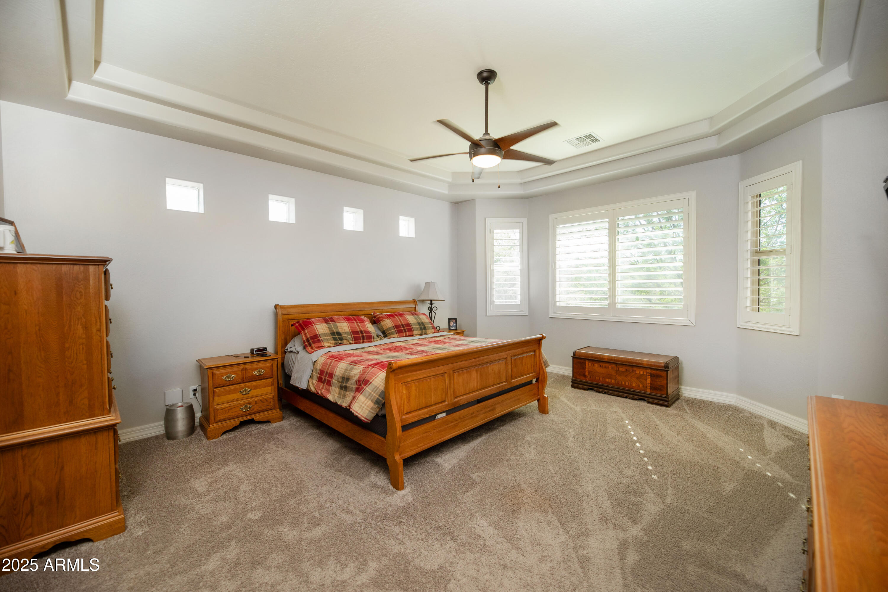 1532 North Roadrunner Road Apache Junction, AZ 85119 - Photo 13 of 51 a bedroom with a bed and a chandelier