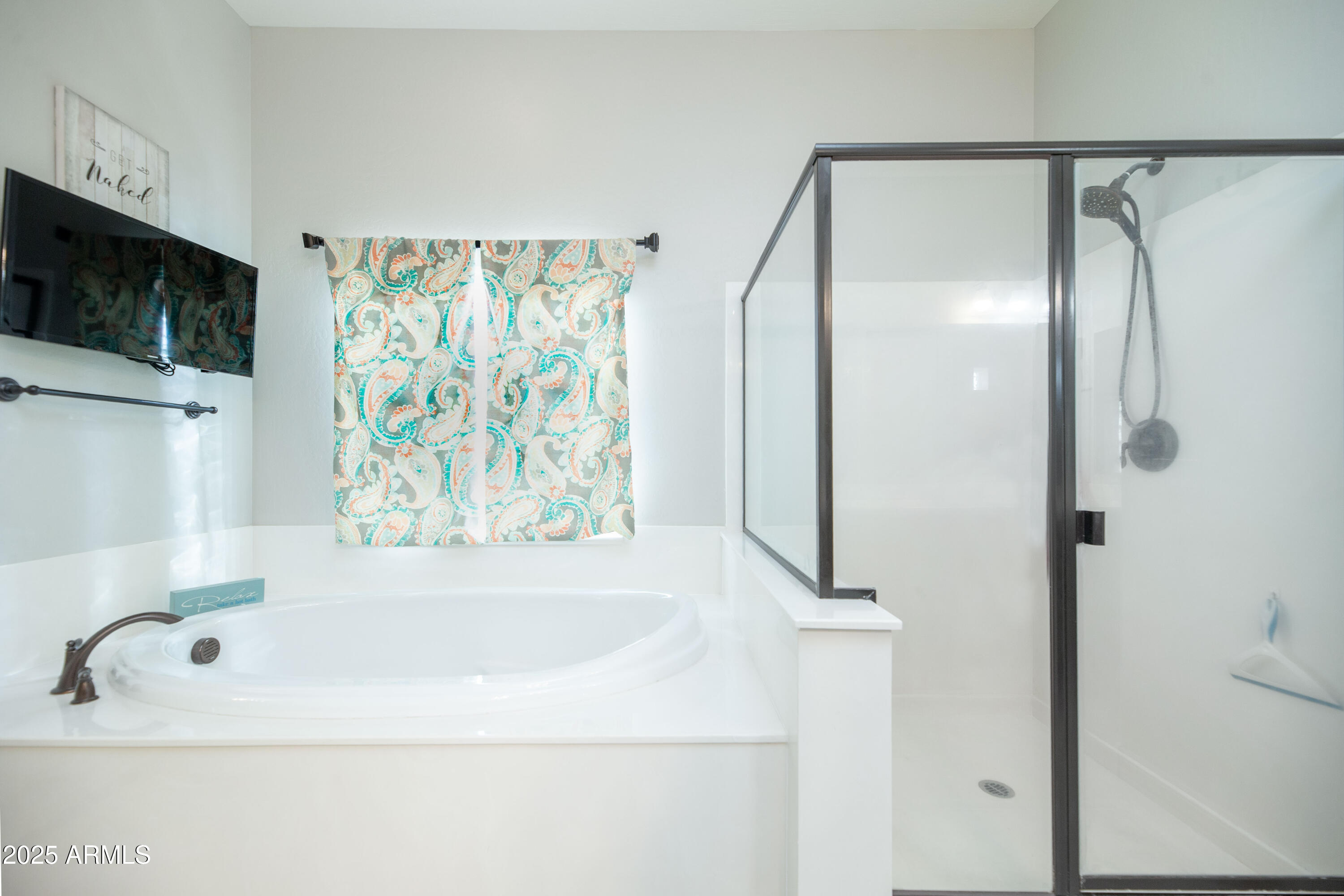1532 North Roadrunner Road Apache Junction, AZ 85119 - Photo 15 of 51 a bathroom with a bathtub and a shower