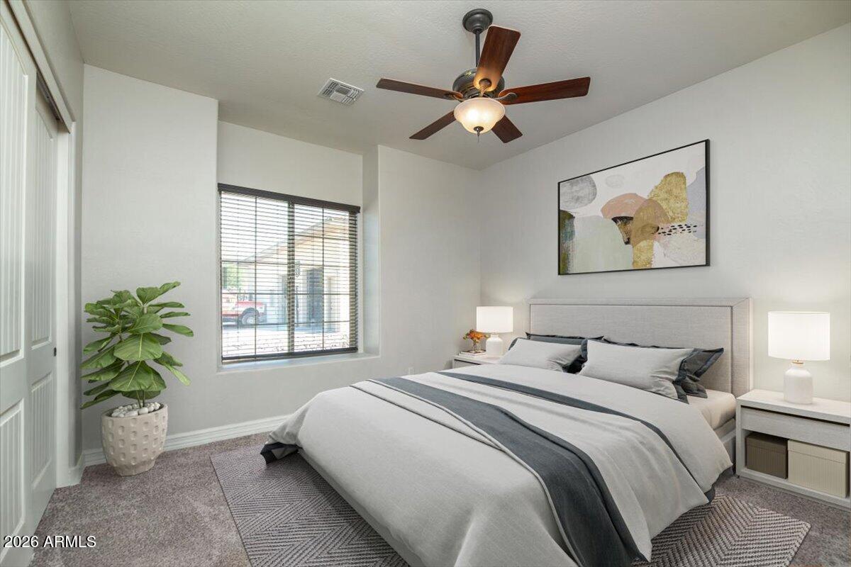 1532 North Roadrunner Road Apache Junction, AZ 85119 - Photo 16 of 54 a bedroom with a large bed and a window