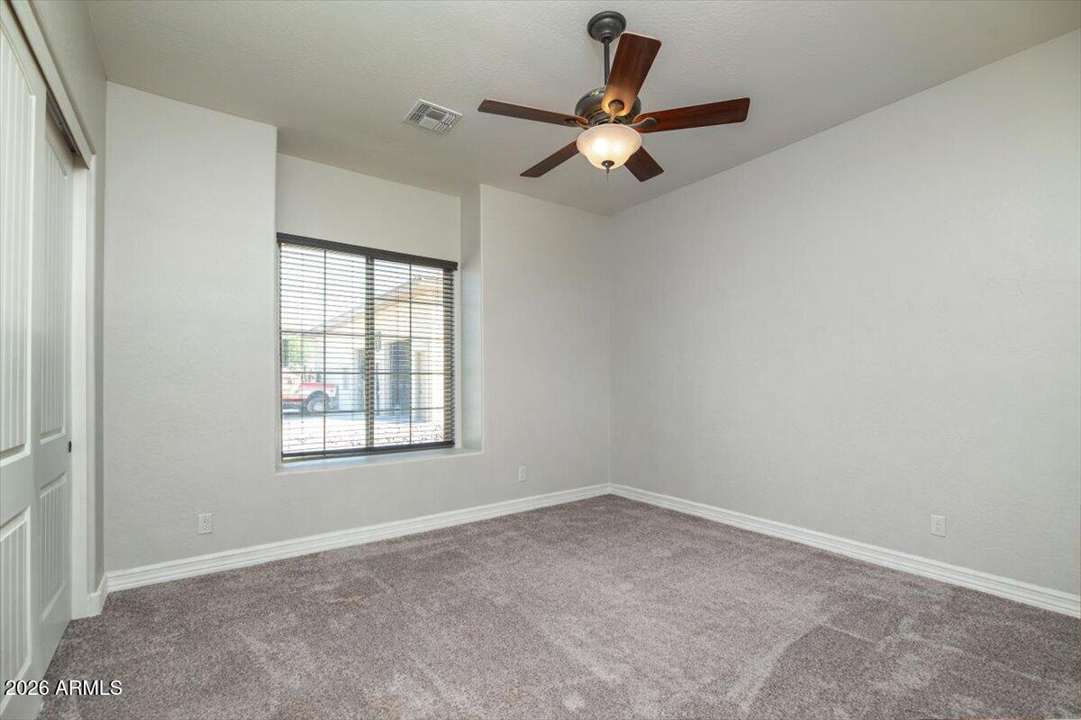 1532 North Roadrunner Road Apache Junction, AZ 85119 - Photo 17 of 54 an empty room with a window