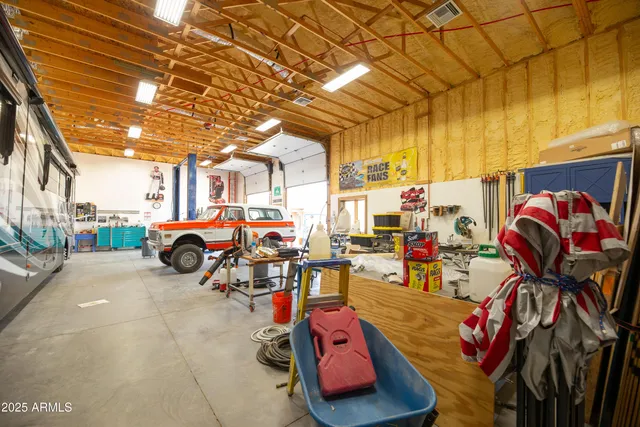 a view of a garage with cars parked