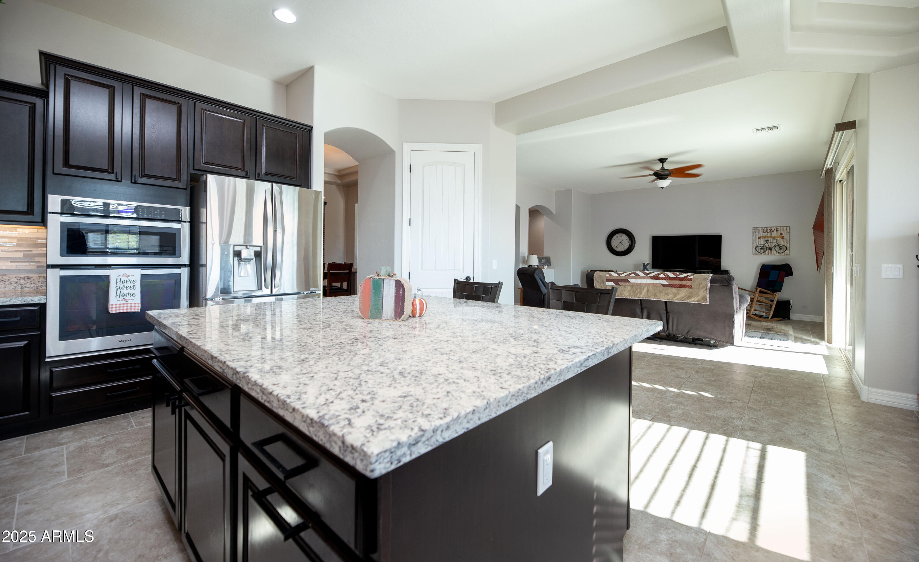 1532 North Roadrunner Road Apache Junction, AZ 85119 - Photo 27 of 51 a kitchen with stainless steel appliances kitchen island granite countertop a kitchen island a stove and a sink