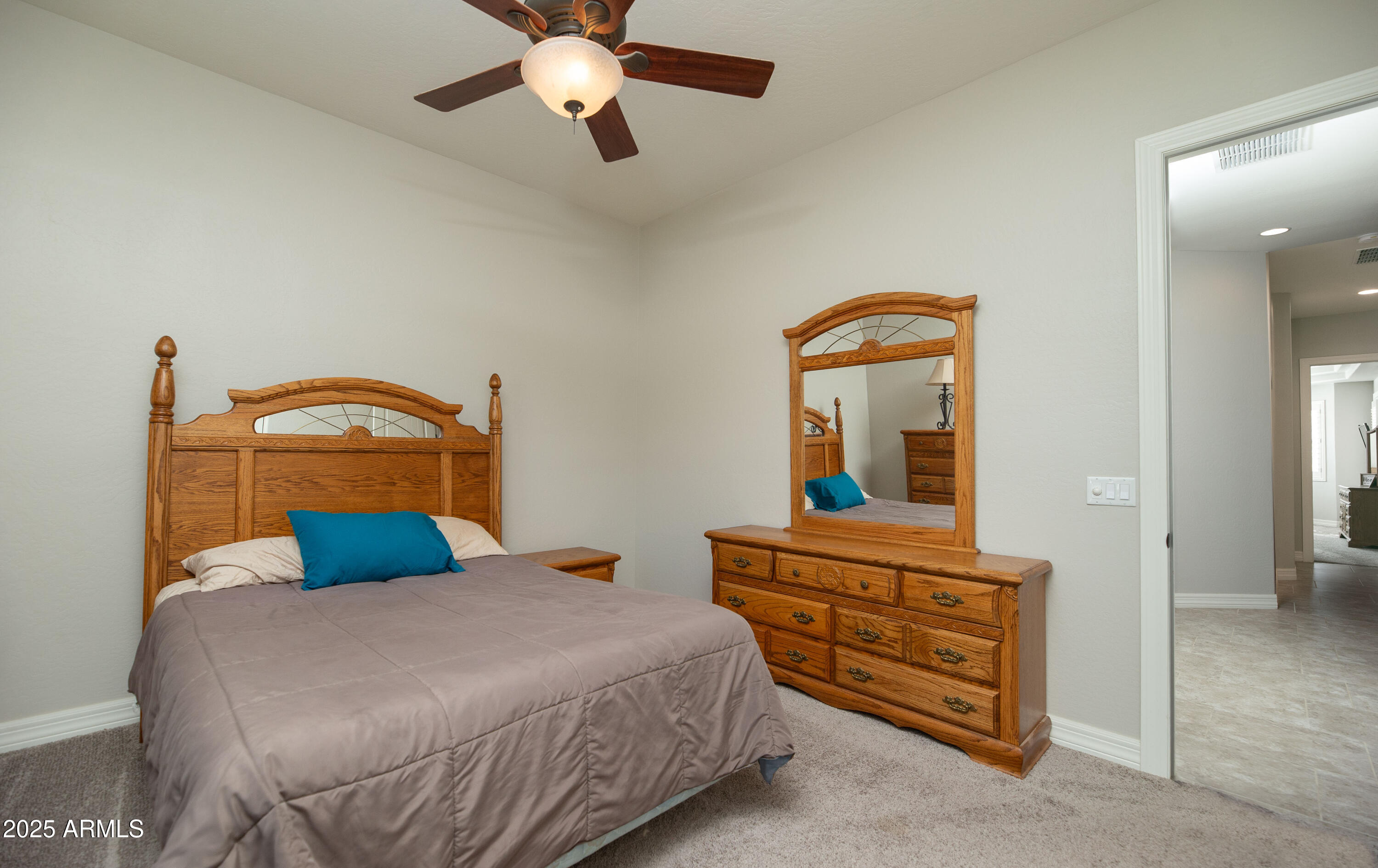 1532 North Roadrunner Road Apache Junction, AZ 85119 - Photo 33 of 51 a bedroom with a bed and a large mirror on the dresser