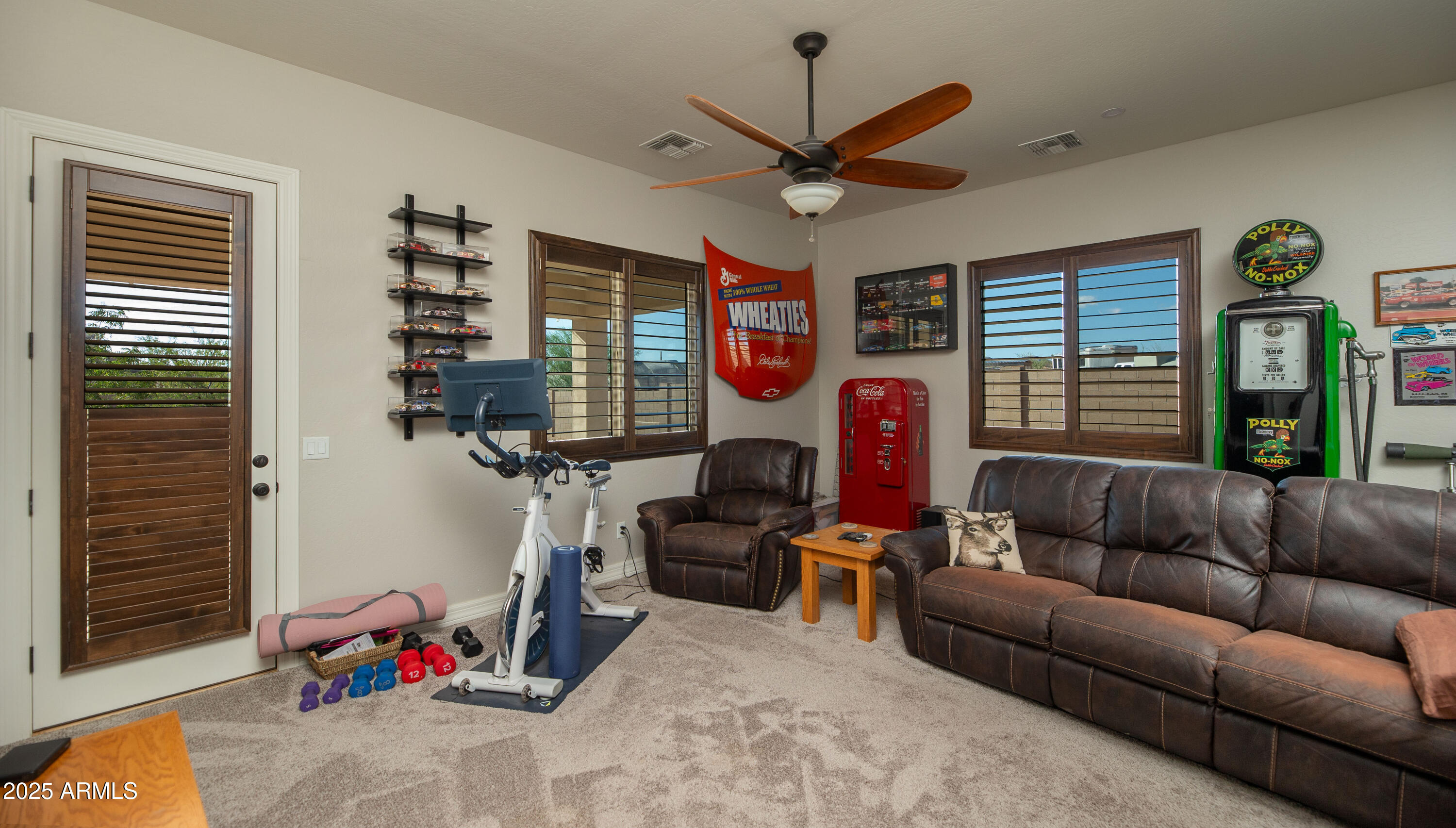 1532 North Roadrunner Road Apache Junction, AZ 85119 - Photo 37 of 51 a living room with furniture a window and gym equipment