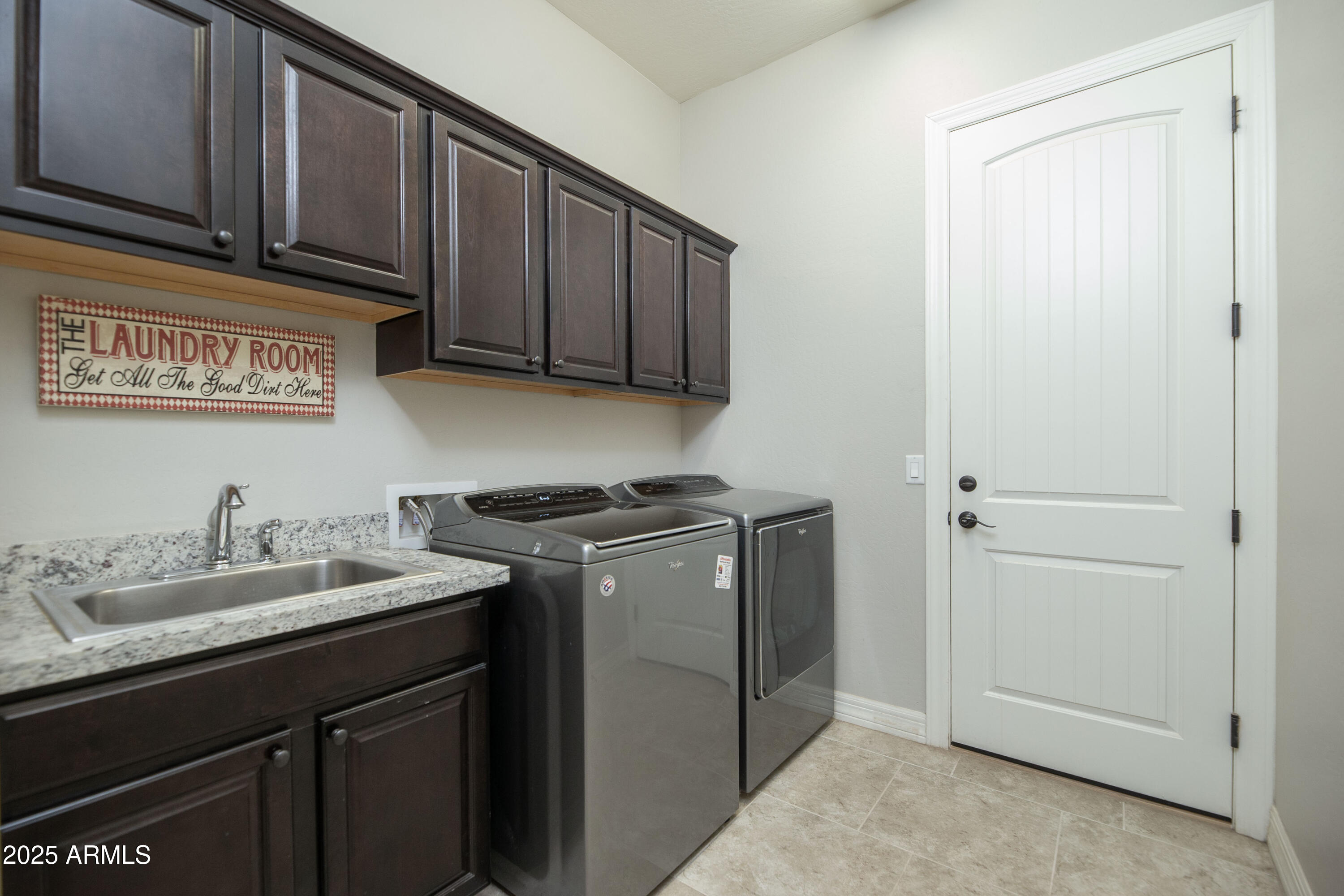 1532 North Roadrunner Road Apache Junction, AZ 85119 - Photo 44 of 55 a utility room with stainless steel appliances granite countertop a sink stove and cabinets