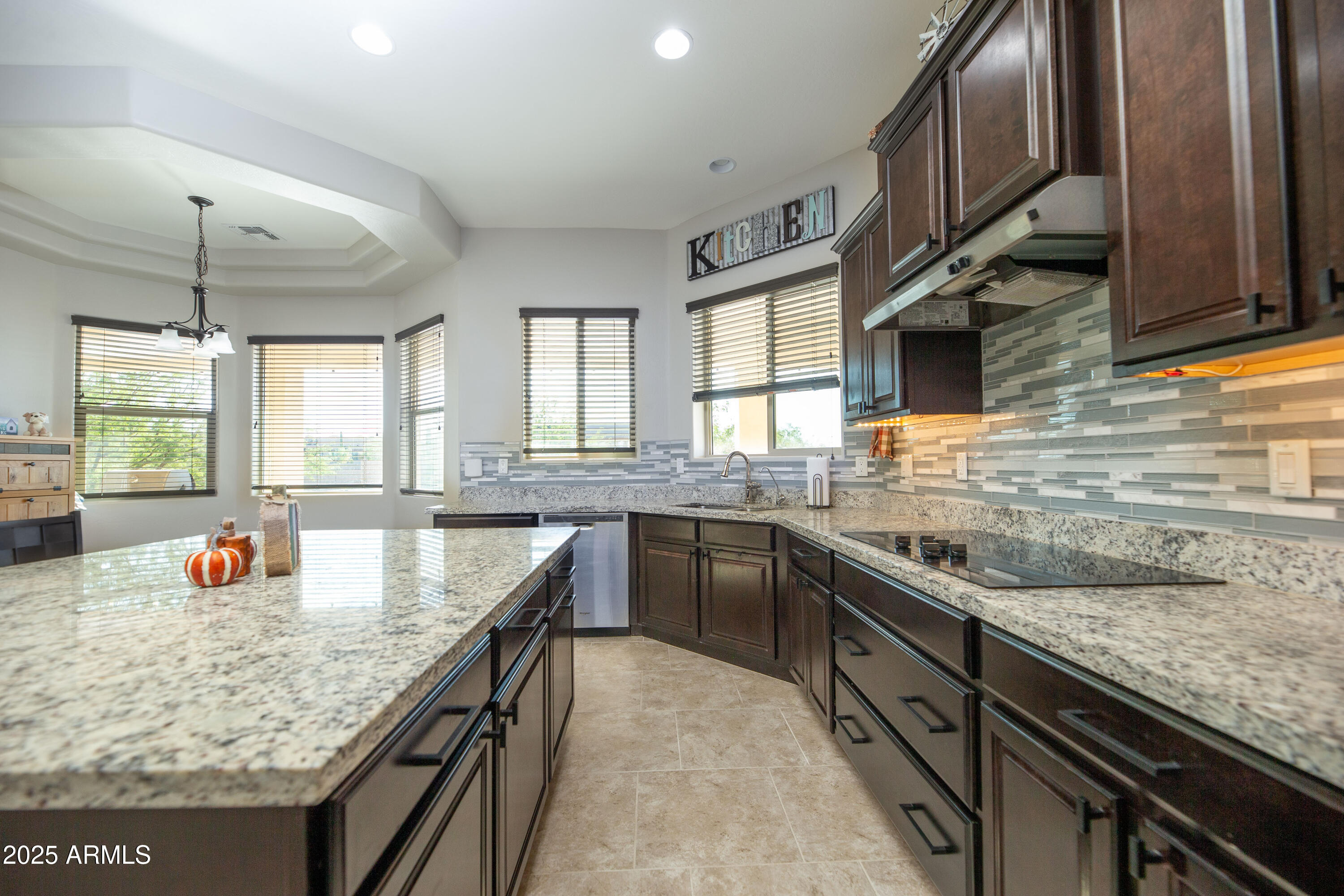 1532 North Roadrunner Road Apache Junction, AZ 85119 - Photo 9 of 54 a kitchen with stainless steel appliances granite countertop a sink stove and refrigerator
