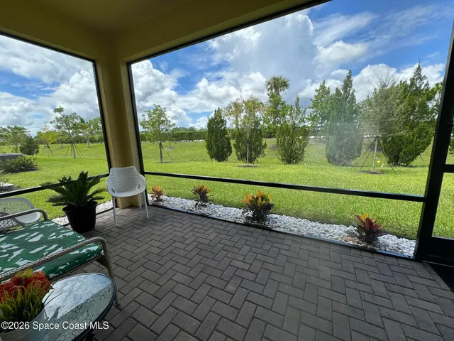 a view of a couple of trees in front of building