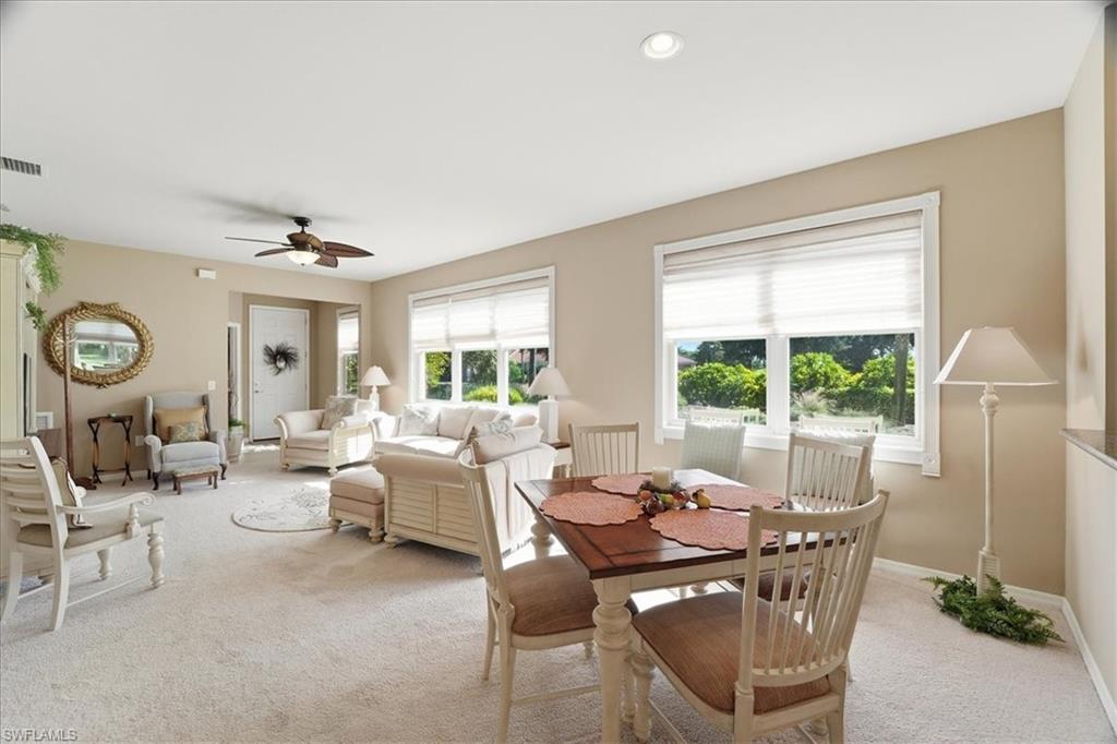 7933 Guadiana Way Ave Maria, FL 34142 - Photo 12 of 50 a living room with fireplace furniture and a large window