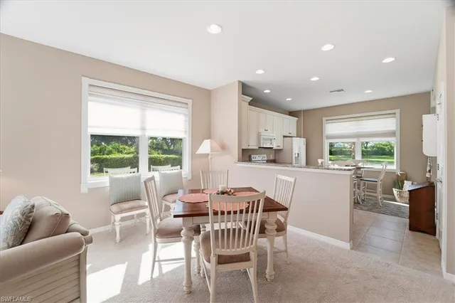 a dining room with furniture and window