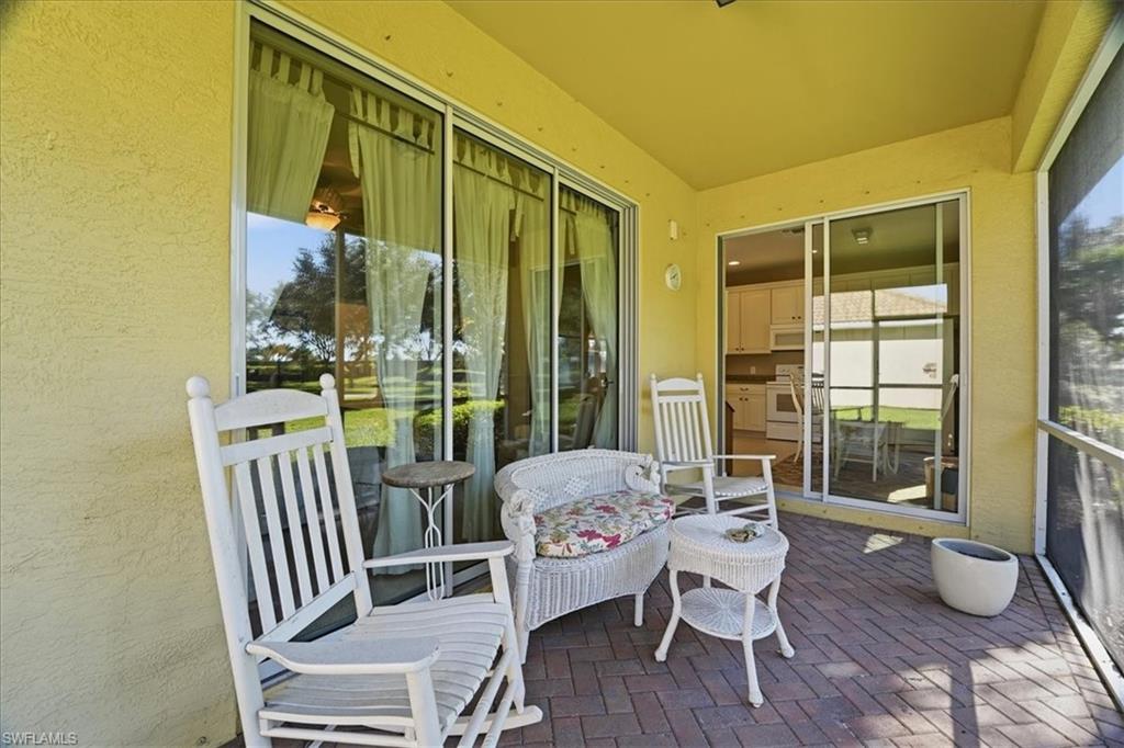 7933 Guadiana Way Ave Maria, FL 34142 - Photo 30 of 50 a living room with furniture and a large window