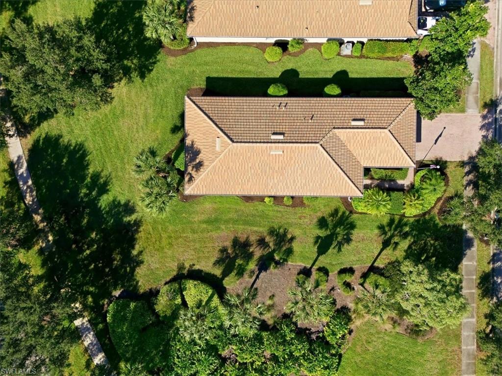 7933 Guadiana Way Ave Maria, FL 34142 - Photo 3 of 50 an aerial view of a house with swimming pool garden and trees