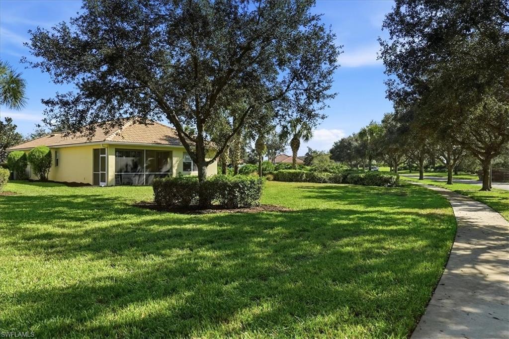 7933 Guadiana Way Ave Maria, FL 34142 - Photo 33 of 50 a view of a house with a big yard