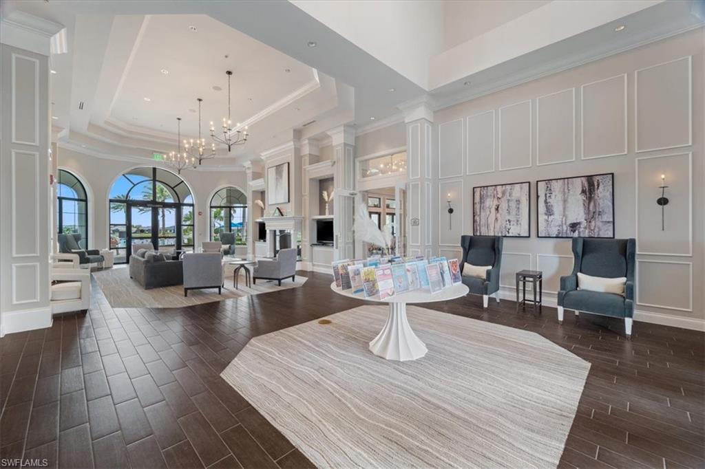 7933 Guadiana Way Ave Maria, FL 34142 - Photo 37 of 50 a living room with lots of furniture and view of kitchen