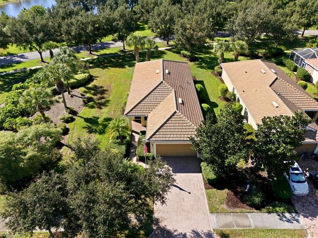 7933 Guadiana Way Ave Maria, FL 34142 - Photo 4 of 50 an aerial view of a house with a yard and plants