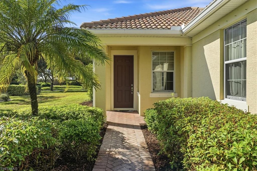 7933 Guadiana Way Ave Maria, FL 34142 - Photo 6 of 50 a view of a house with brick walls