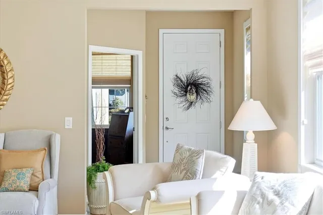 a living room with furniture and a lamp