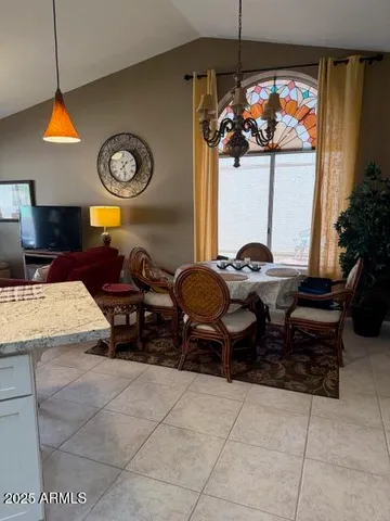 a dinning table and chairs in a room