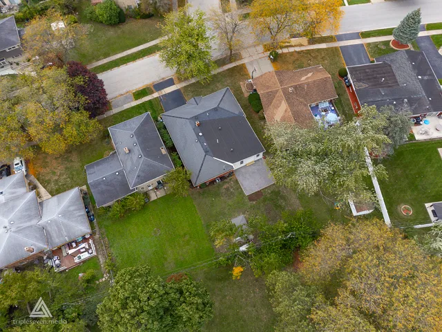 an aerial view of a house with a garden