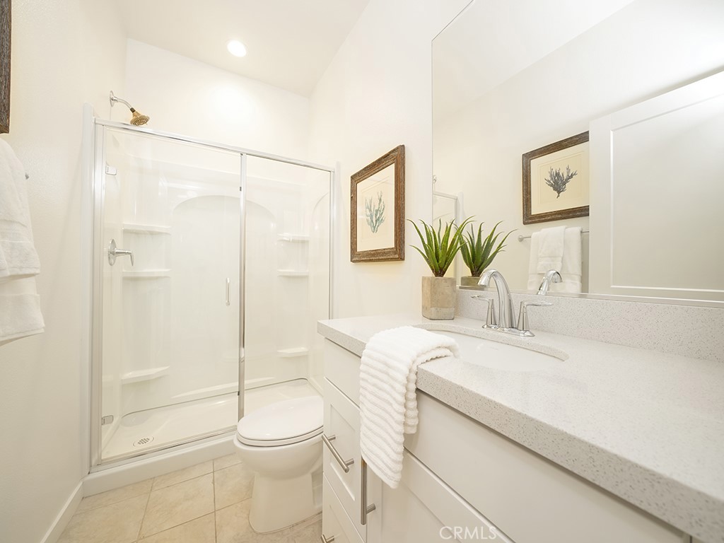 603 Shadowbrook Lake Forest, CA 92610 - Photo 19 of 23 a bathroom with a sink a toilet and shower
