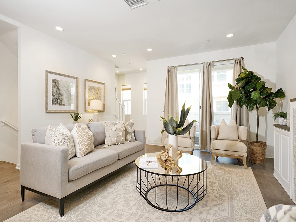 603 Shadowbrook Lake Forest, CA 92610 - Photo 2 of 23 a living room with furniture a couch and a potted plant