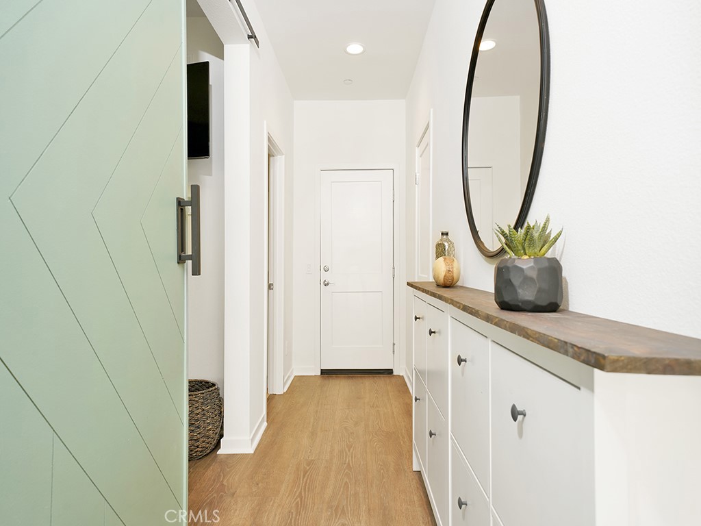 603 Shadowbrook Lake Forest, CA 92610 - Photo 21 of 23 a bathroom with a granite countertop sink a mirror and a shower