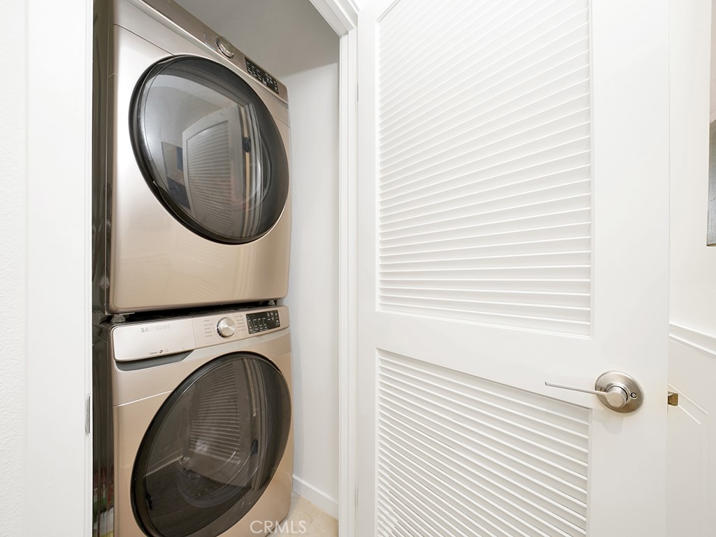 603 Shadowbrook Lake Forest, CA 92610 - Photo 22 of 23 a close view of a utility room with dryer and washer