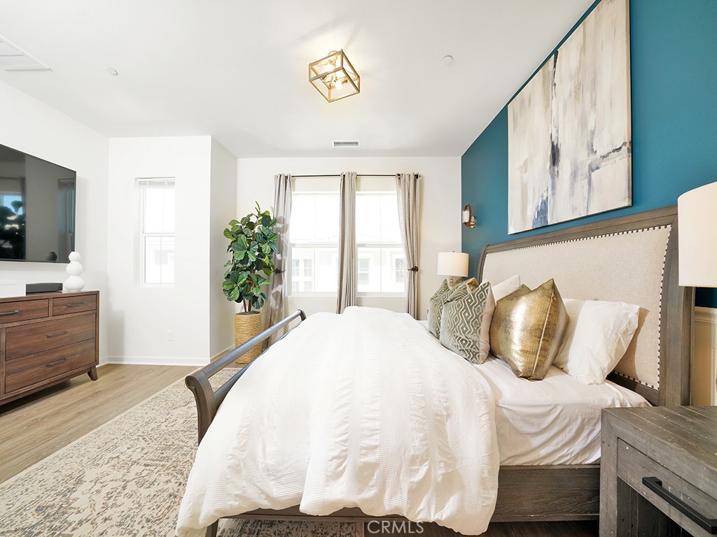 603 Shadowbrook Lake Forest, CA 92610 - Photo 10 of 23 a bedroom with a bed and flat screen tv