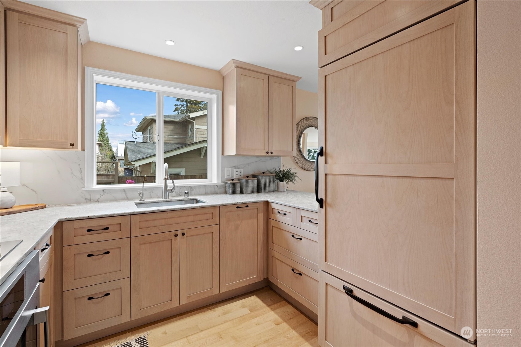7209 Dayton Avenue North Seattle, WA 98103 - Photo 11 of 33 a kitchen with sink cabinets and refrigerator