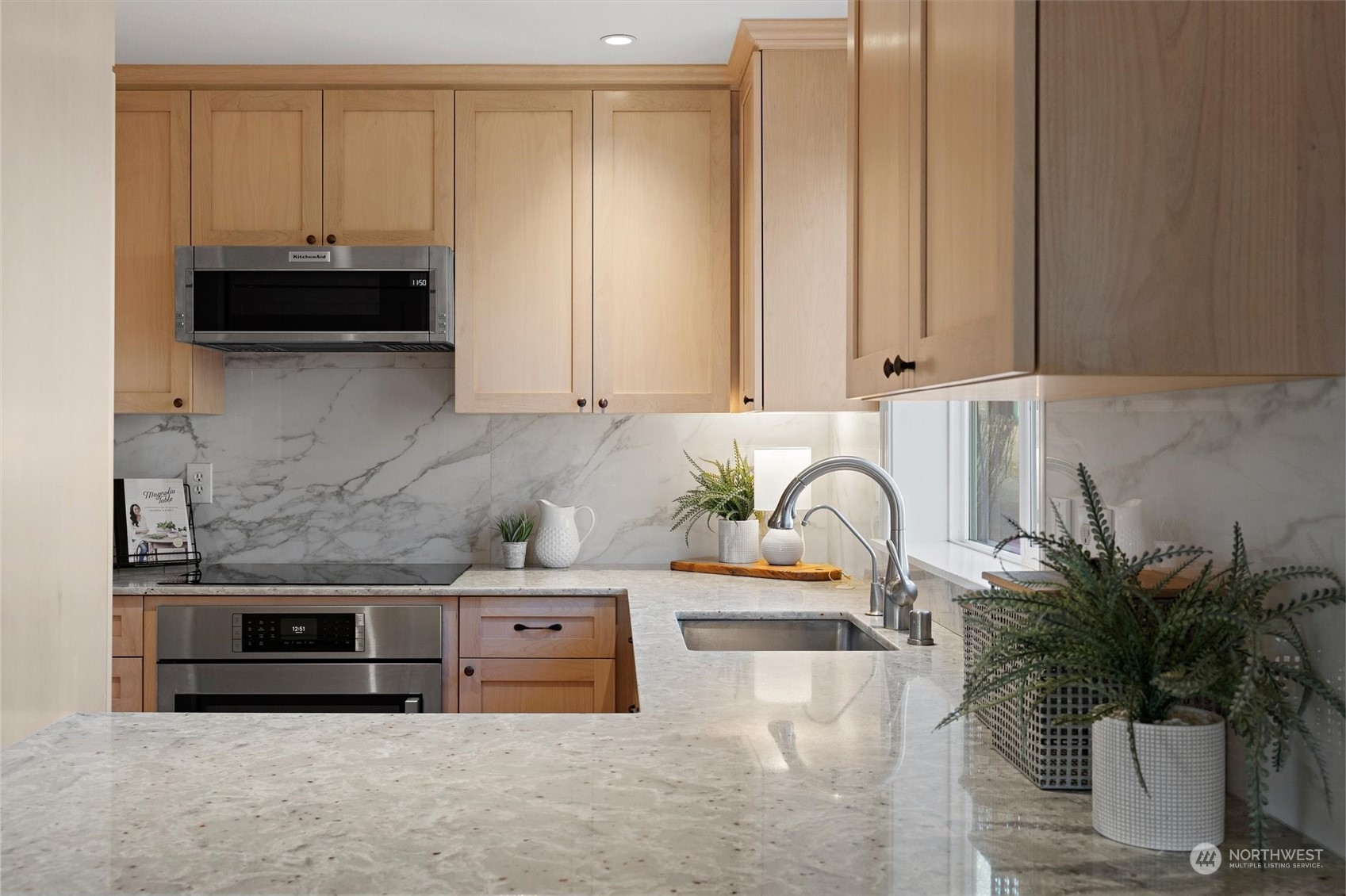 7209 Dayton Avenue North Seattle, WA 98103 - Photo 13 of 33 a kitchen with stainless steel appliances granite countertop a sink a stove and a microwave